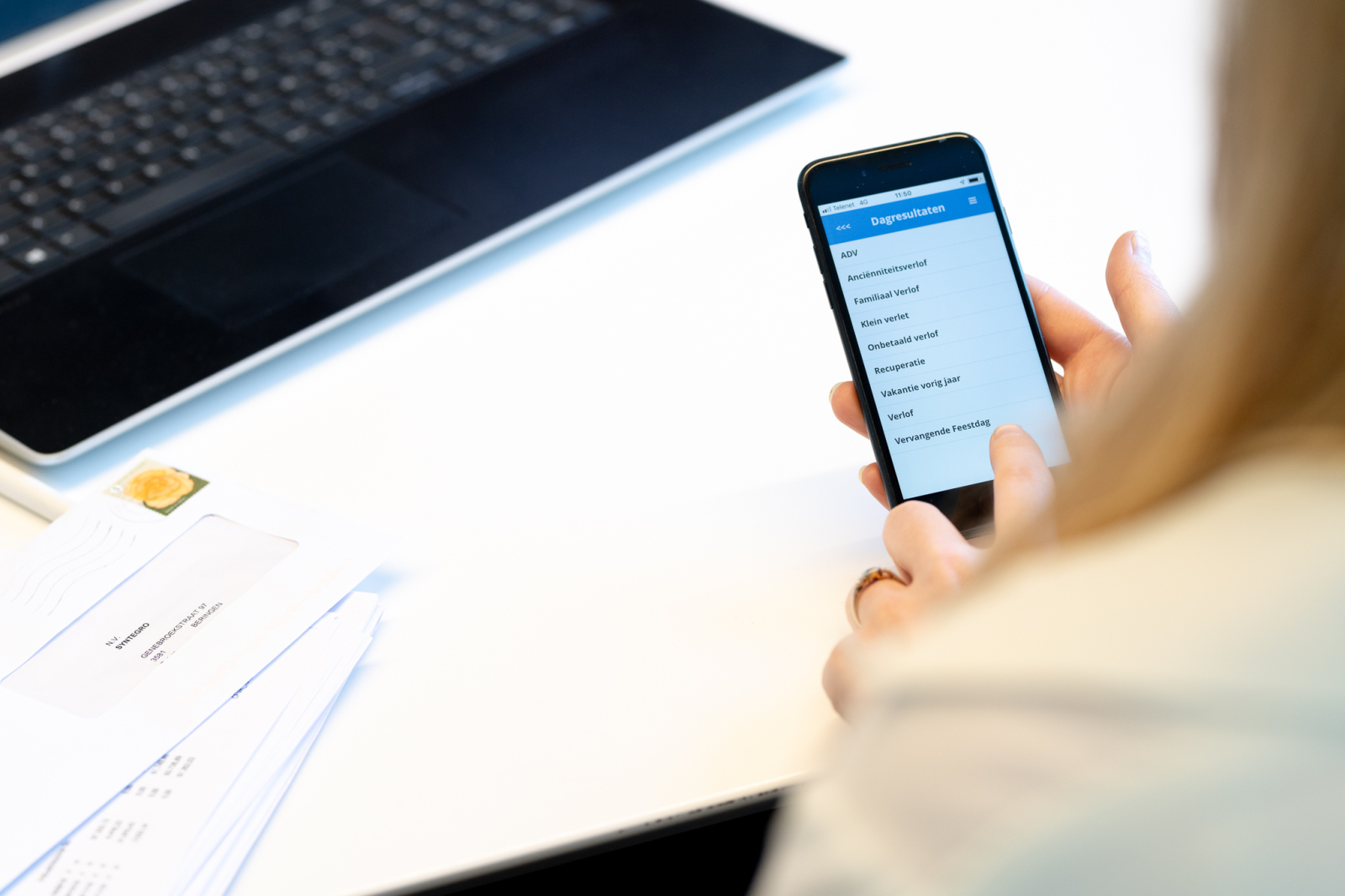 Woman who uses the smartphone app for employee selfservice